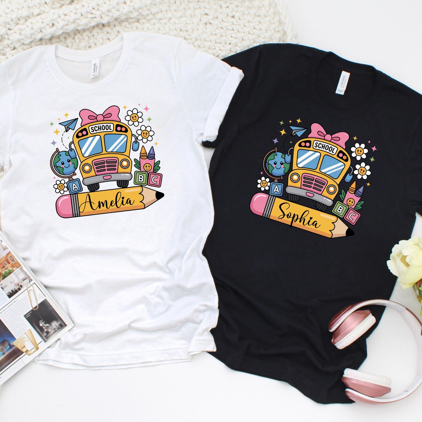 Custom back-to-school t-shirts featuring a colorful school bus design with fun elements like pencils, globes, and ABC blocks. Each shirt includes a large pencil graphic personalized with the childβs name. Available in black and white shirt options. Perfect for kids' first day of school photos and matching classroom outfits.