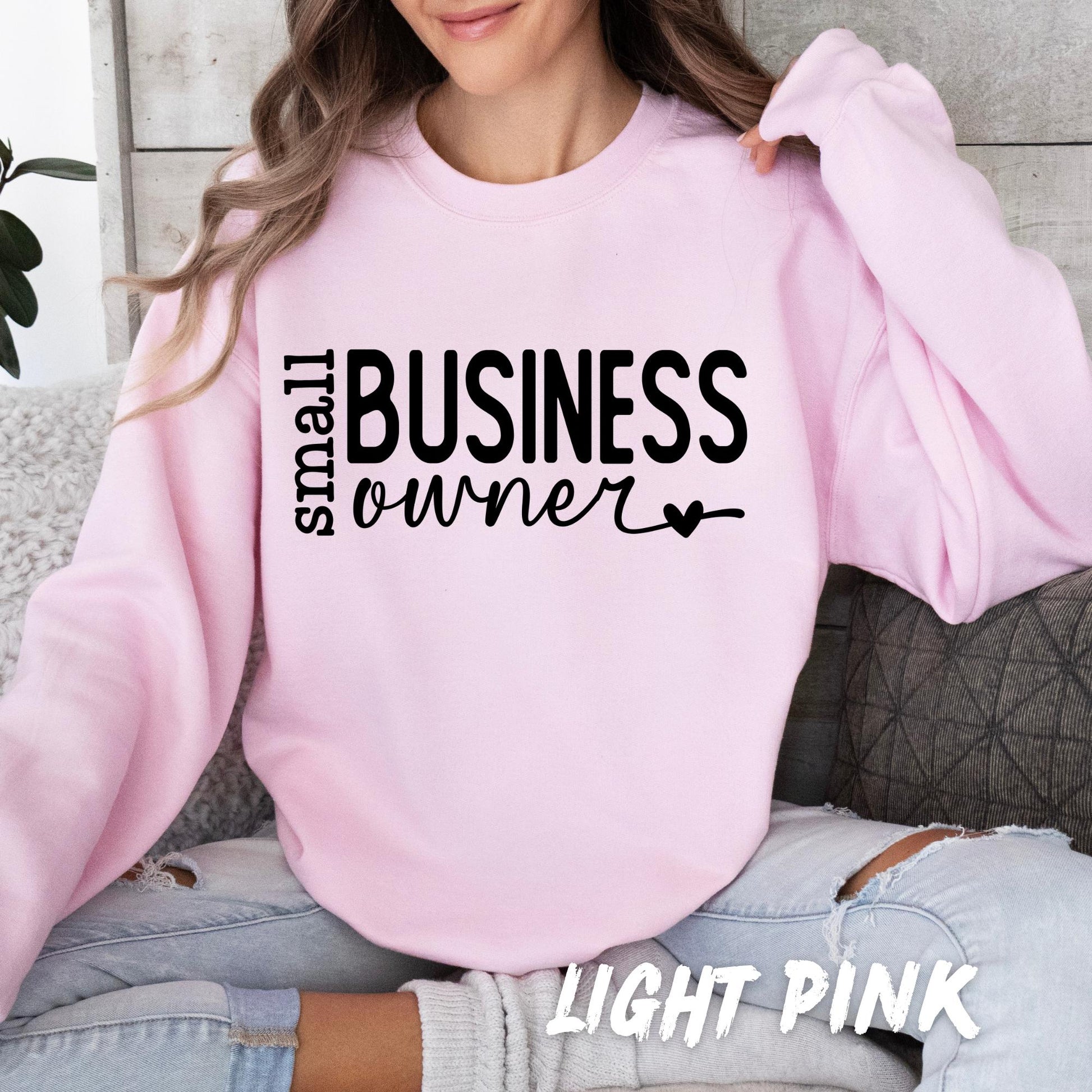 Light pink Gildan sweatshirt mockup displaying the Small Business Owner graphic design.