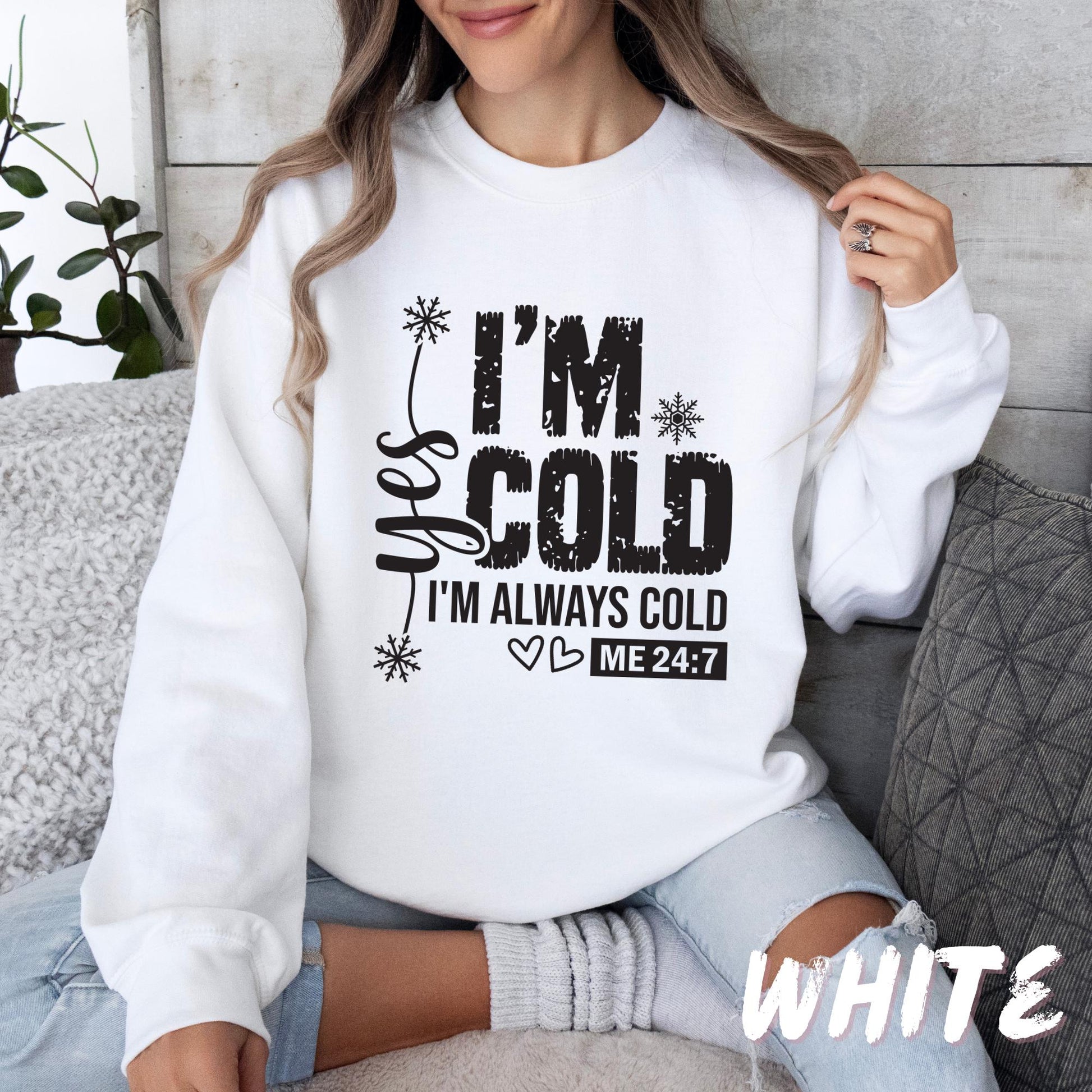 White unisex sweatshirt with bold black lettering that reads &quot;Wake Me Up When Winter Is Over,&quot; decorated with snowflakes, dots, and botanical elements. A cozy, funny cold-weather pullover for adults and kids.