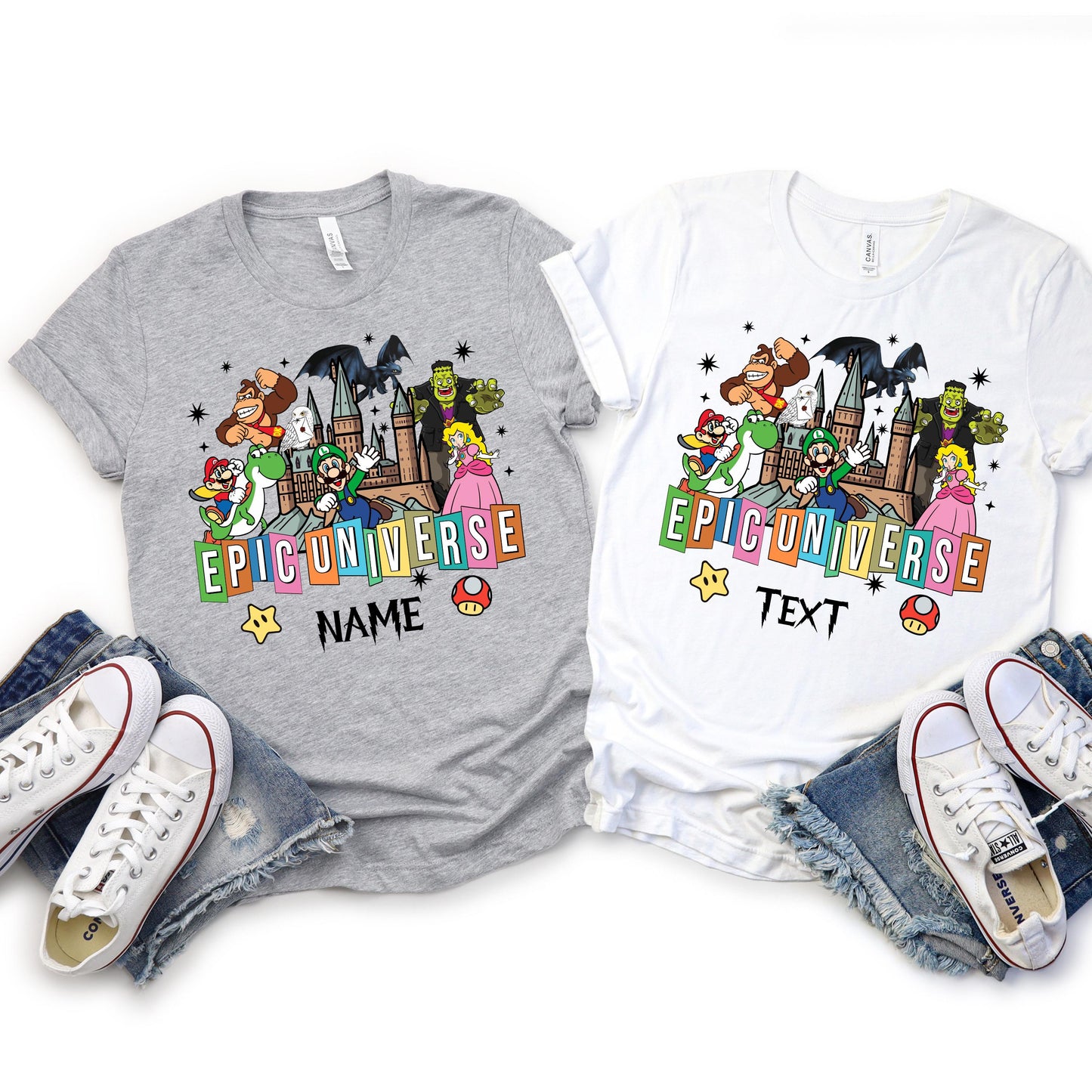 t-shirts, one gray and one white, with a colorful 'Epic Universe' design featuring popular cartoon and video game characters including Mario, Luigi, Yoshi, Princess Peach, Donkey Kong, Frankenstein, and others, standing in front of a castle. The design also includes stars, mushrooms, and customizable text options below the logo.