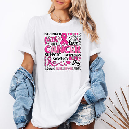 T-shirt with a pink and black breast cancer awareness design featuring words like ‘Strength,’ ‘Faith,’ ‘Cure,’ ‘Support,’ ‘Hope,’ ‘Believe,’ and ‘Brave,’ along with pink ribbons, hearts, flowers, and peace symbols.