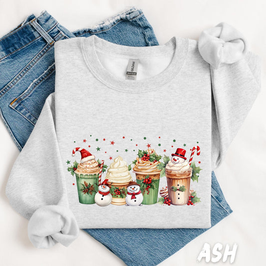 Unisex sweatshirt with a festive design featuring holiday coffee cups topped with whipped cream, holly, candy canes, and snowmen. Surrounded by red and green stars—perfect cozy pullover for Christmas coffee lovers.