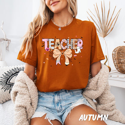 Halloween Teacher Shirt – Cute Teacher Graphic Tee with Pumpkin Bow & Ghosts | Fun Halloween Teacher Outfit | Spooky Teacher Gift Shirt