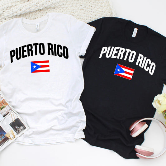 Unisex Puerto Rico t-shirts in black and white with bold PUERTO RICO text and Puerto Rican flag graphic. Short sleeve casual tee for men and women, perfect for Boricua pride, heritage, and cultural celebrations.