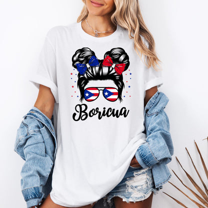 Puerto Rican pride t-shirt featuring a “Boricua” design with a woman’s hair in a bun, red and blue bows, and sunglasses showing the Puerto Rico flag. This Puerto Rico shirt listing includes multiple design options: “Boricua girl with sunglasses,” “Puerto Rico text with flag,” “Puerto Rico tropical style,” “Chancla Survivor,” “I’m Not Yelling I’m Puerto Rican,” “Puerto Rico heart flag,” “Puerto Rican cultural collage,” and “Yo Soy Boricua” with map and flag.