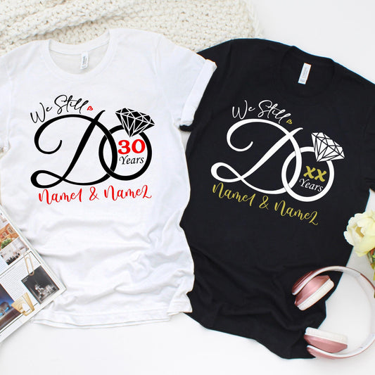 Personalized anniversary shirt design with “We Still Do” and diamond ring graphic.
Custom couple t-shirt with names and years for wedding anniversary celebration.
We Still Do anniversary tee with diamond design, personalized with names.
Custom wedding anniversary shirt, add couple names and milestone years.
Anniversary celebration shirt, customizable names and years, elegant diamond design.
Custom matching anniversary t-shirts with “We Still Do” and milestone year.