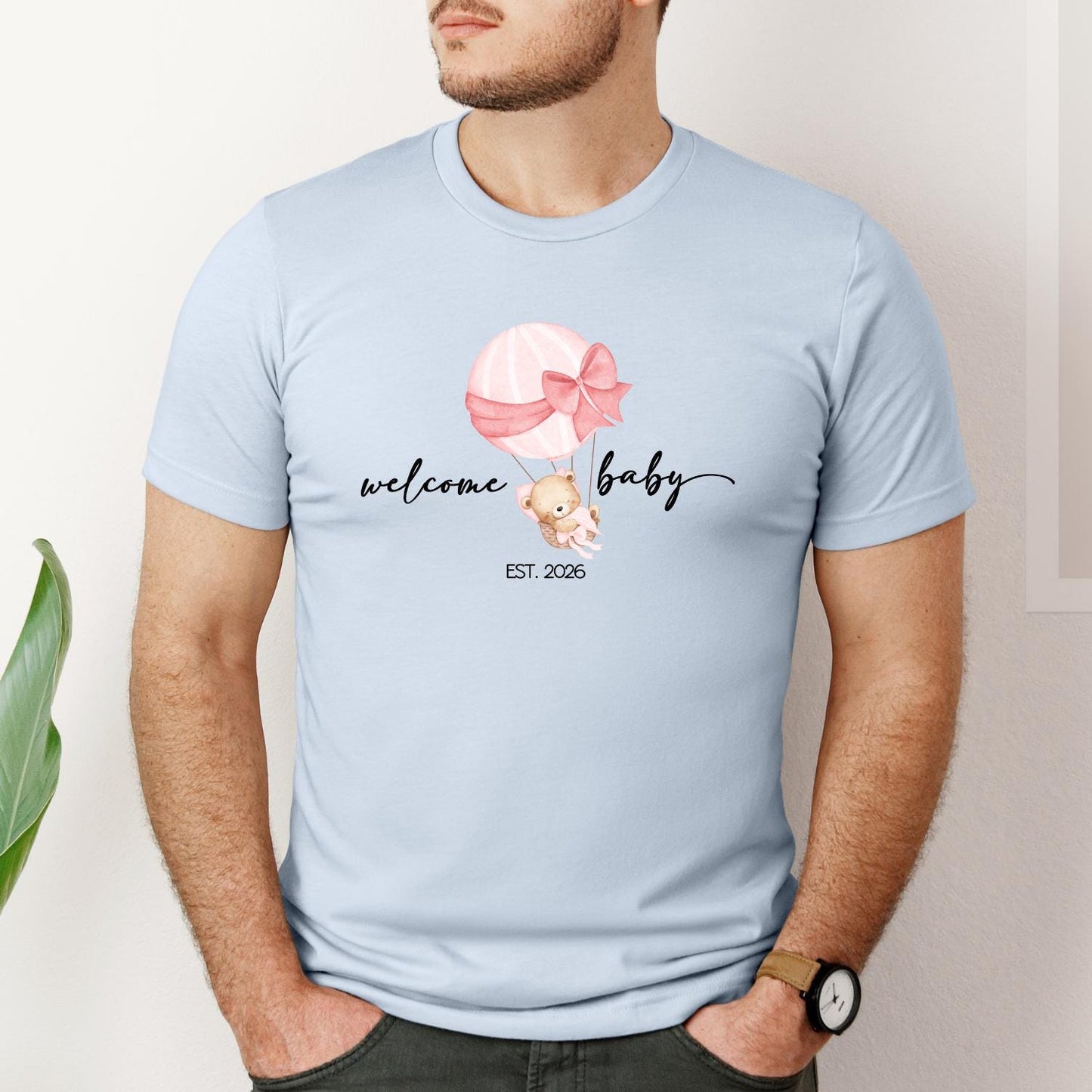 Cute family matching shirts for baby announcement — ‘Welcome Baby EST. 2026’ design with a bear in a balloon, ideal for pregnancy reveal or newborn photos.