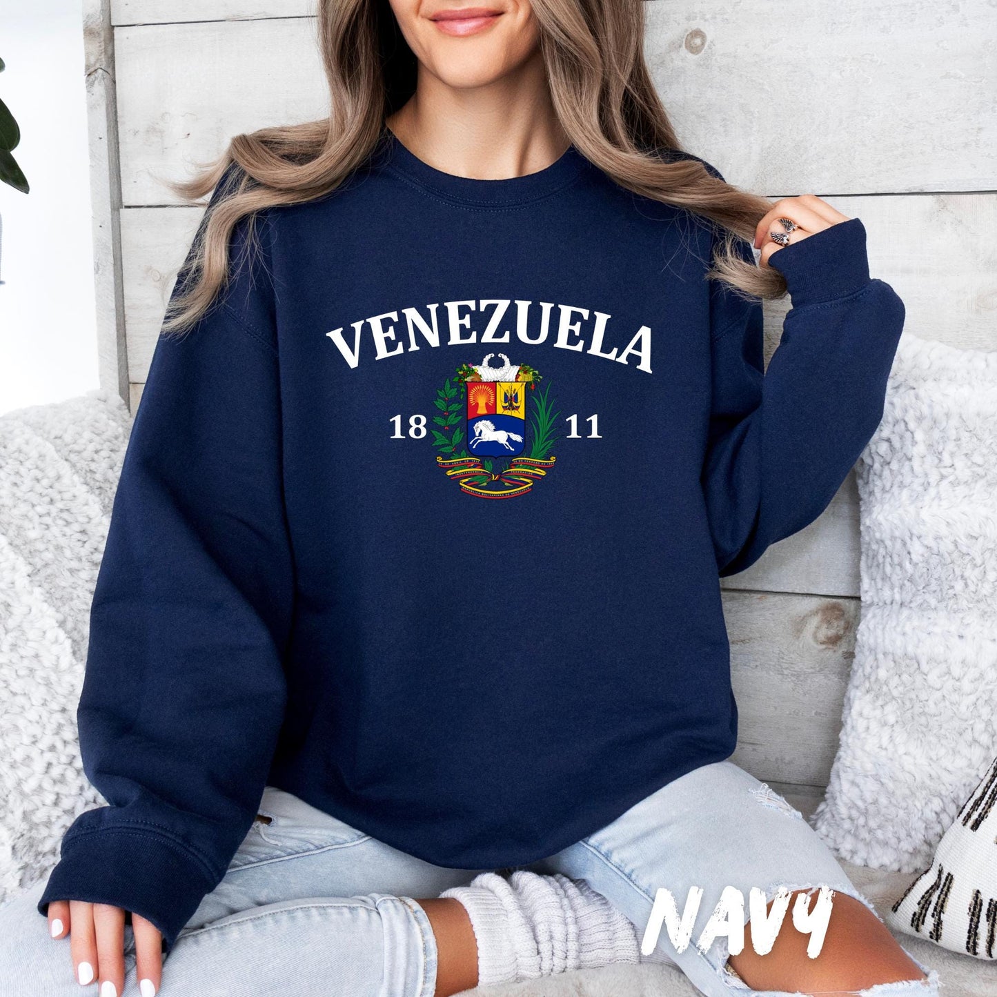 unisex crewneck sweatshirt featuring ‘Venezuela’ lettering and Venezuelan coat of arms graphic, casual cozy outfit
