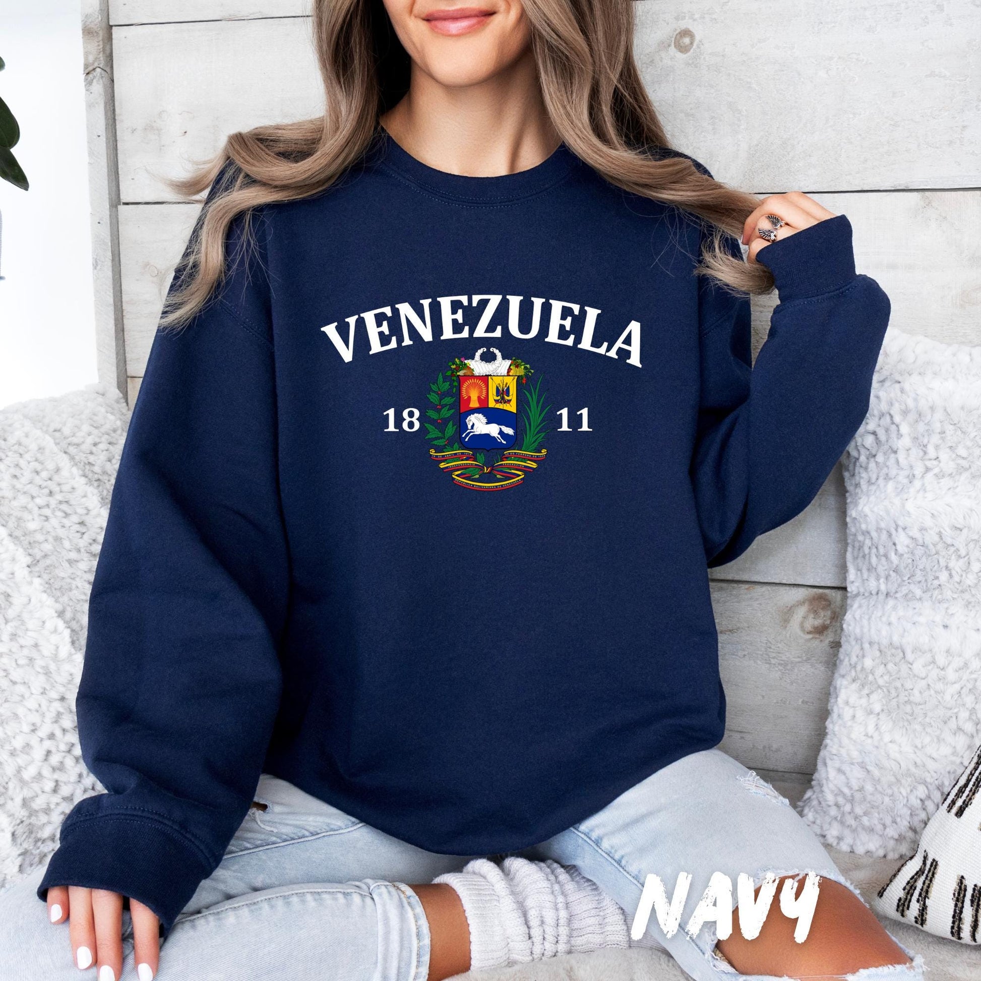 unisex crewneck sweatshirt featuring ‘Venezuela’ lettering and Venezuelan coat of arms graphic, casual cozy outfit