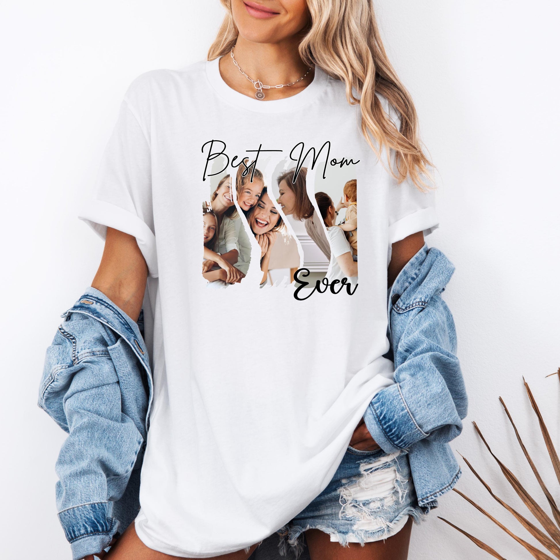 White t-shirt featuring a “Best Mom Ever” custom photo collage design with family photos. The model is wearing a casual white tee with denim shorts and a jean jacket, showcasing a personalized gift shirt perfect for Mother’s Day or moms.