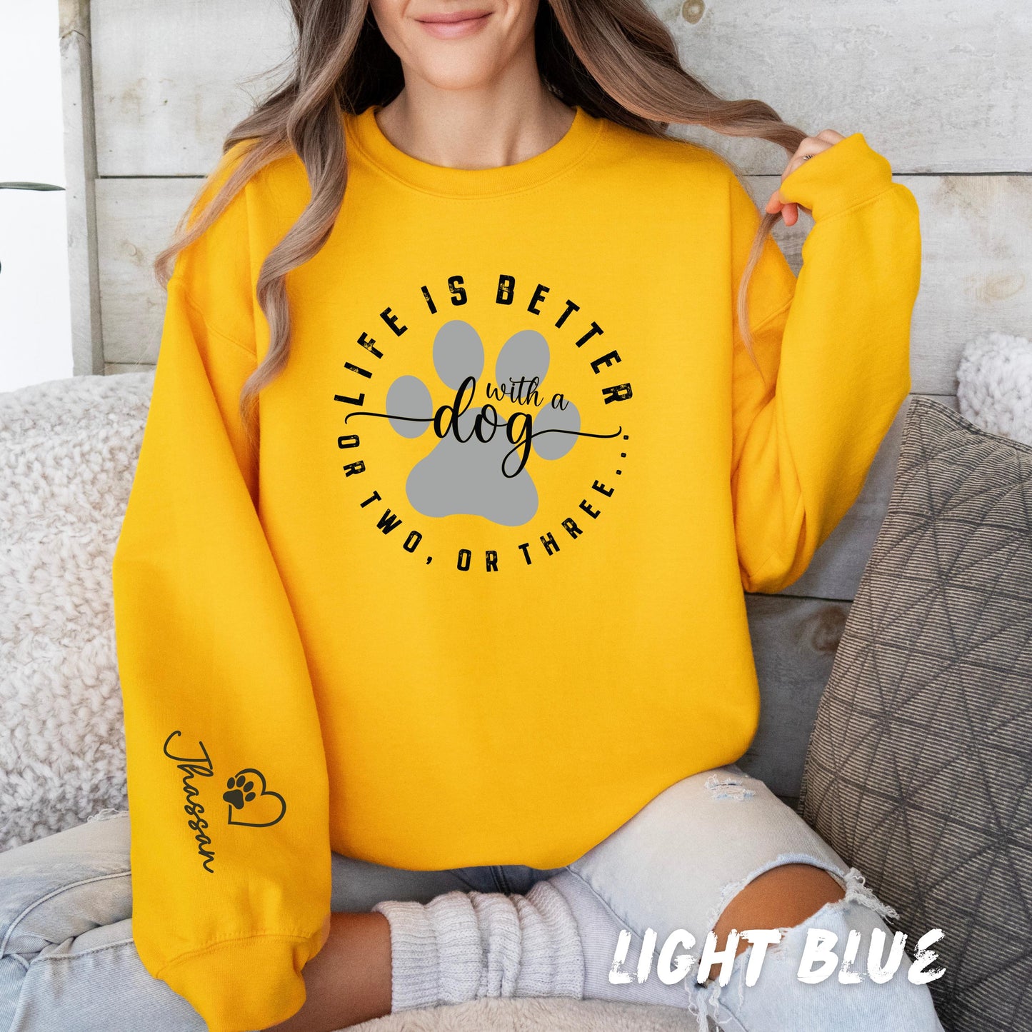 Dog mom gift sweatshirt with custom pet name on sleeve and modern typography design
