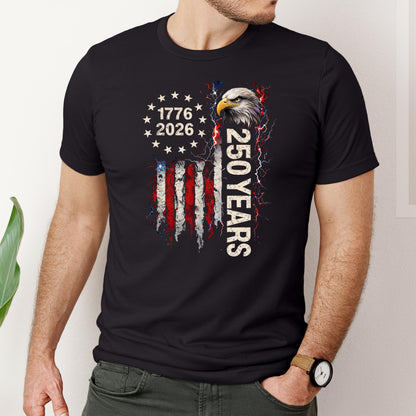America 250th anniversary shirt with bald eagle, stars circle, and distressed USA flag design with “1776 2026” text on unisex black and white tees.