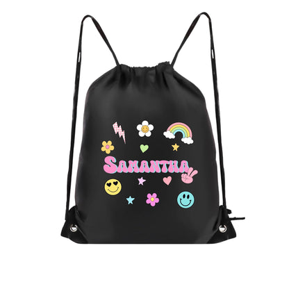 Custom name drawstring backpack featuring colorful retro-style graphics including smiley faces, rainbow, flowers, hearts, stars, and lightning bolt. Personalized with the name “Samantha” in bold pastel bubble letters. Lightweight black gym bag made with durable material and vibrant DTF print, perfect for kids, travel, school, cruise gifts, or matching family outfits. Spacious size ideal for carrying snacks, toys, and daily essentials.