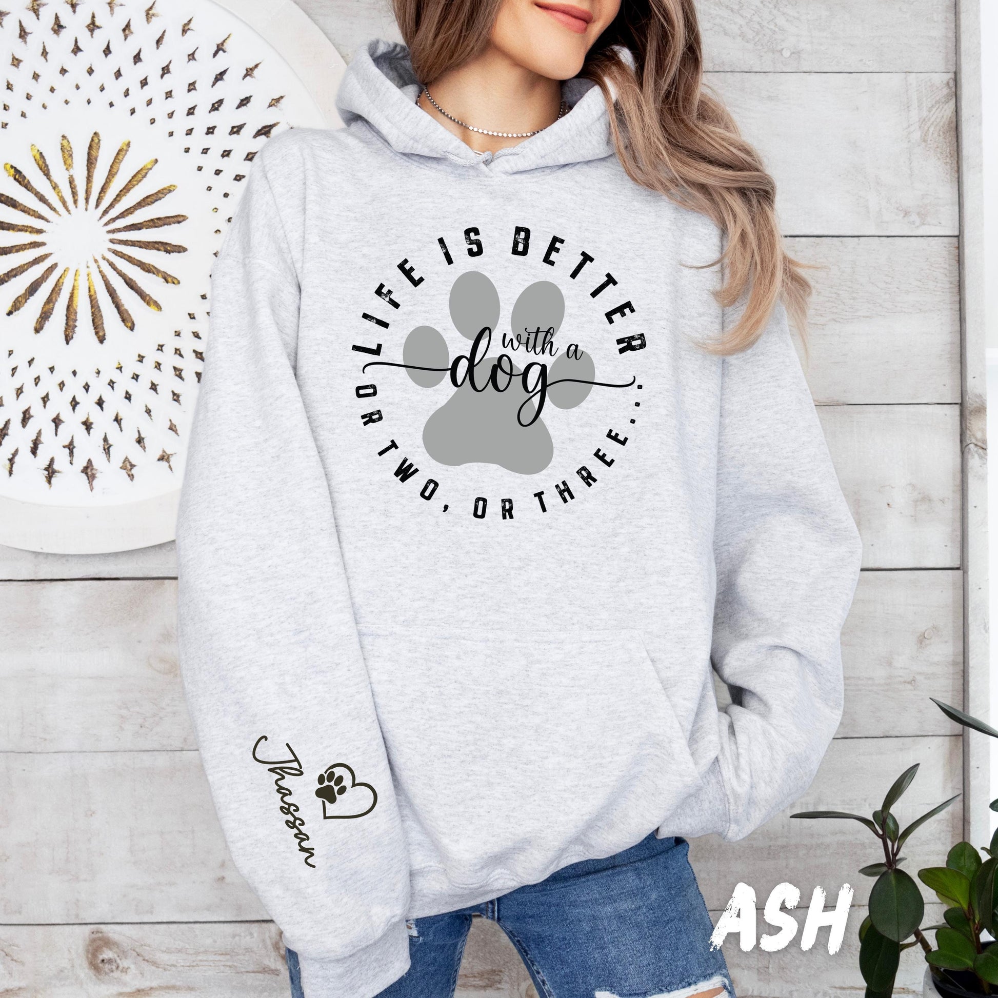 Personalized pet lover hoodie with paw print and custom dog name on arm