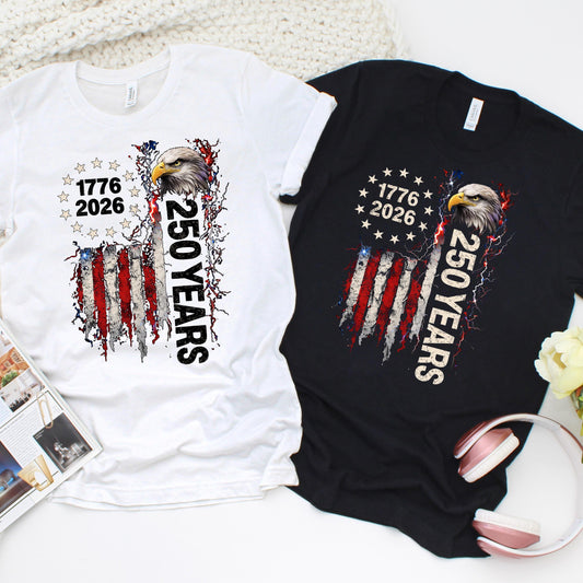 Patriotic 250 years t-shirt design with bald eagle, distressed American flag, and “1776 2026” text, shown on white and black Bella Canvas shirts for America’s 250th anniversary.