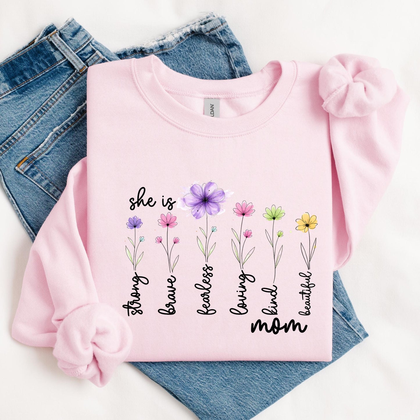 Pink sweatshirt with colorful floral design and inspirational words strong brave fearless loving kind beautiful mom, perfect Mother’s Day gift