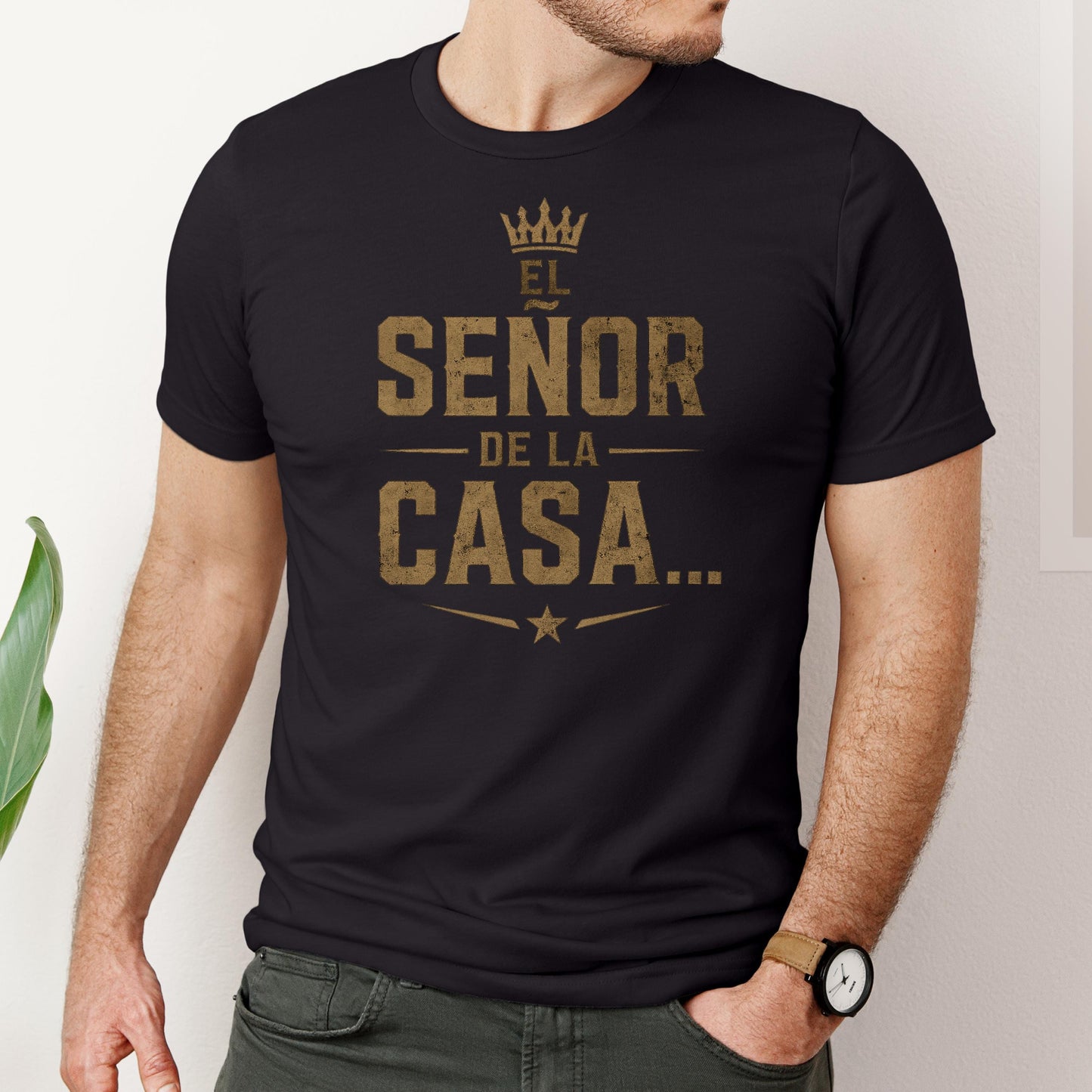 Funny Spanish dad shirt with “El Señor De La Casa” quote in distressed gold lettering on a black unisex t-shirt.