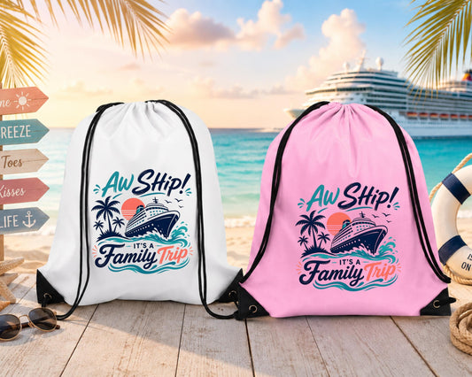 family cruise drawstring backpacks in white and pink featuring an "Aw Ship! It's a Family Trip" design, displayed on a tropical beach with a cruise ship in the background.