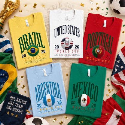 Flat lay of World Cup 2026 inspired country soccer shirts featuring United States, Brazil, Portugal, Argentina, and Mexico designs surrounded by soccer-themed decorations, flags, and championship-inspired elements.