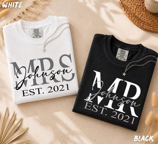Personalized family name shirts with custom last name and established year shown on white and black Comfort Colors t-shirts.