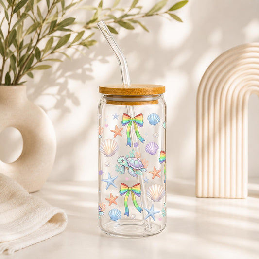 20oz sea turtle glass cup with bamboo lid and glass straw featuring rainbow bows seashells starfish and coastal ocean design