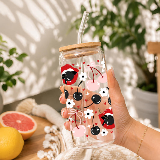 20oz glass can cup with bamboo lid and glass straw featuring cute cherry, black cherry, lips, hearts, and coquette aesthetic artwork.