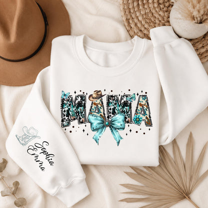 White Gildan crewneck sweatshirt featuring a personalized Western Mama design with turquoise cowhide lettering, cowboy hats, turquoise bow, butterflies, and a custom name printed on the sleeve.