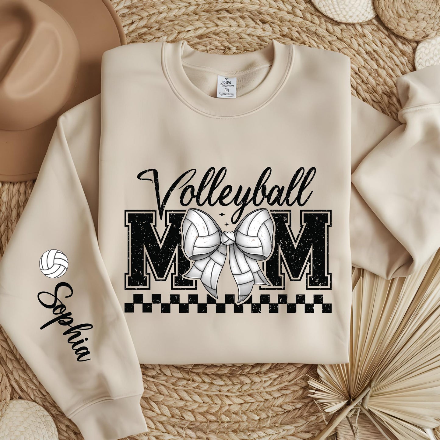 Personalized Volleyball Mom sweatshirt with custom sleeve name and trendy coquette bow design.