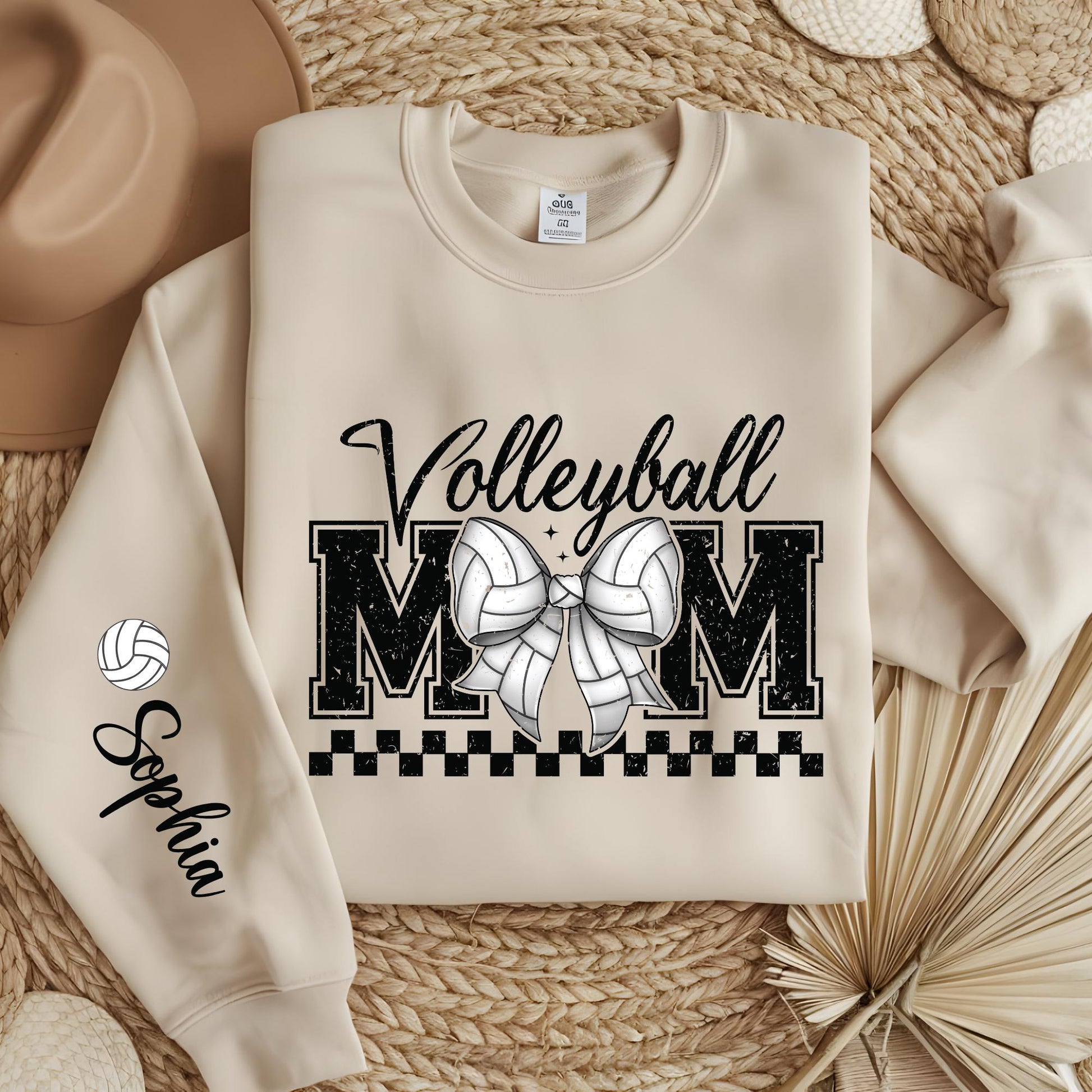 Personalized Volleyball Mom sweatshirt with custom sleeve name and trendy coquette bow design.