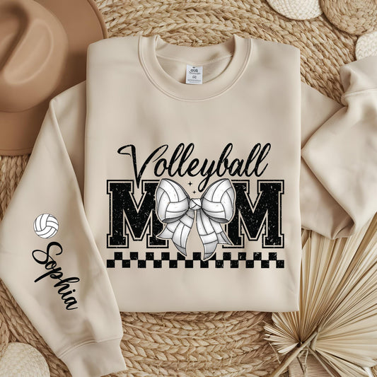 Personalized Volleyball Mom sweatshirt with custom sleeve name and trendy coquette bow design.