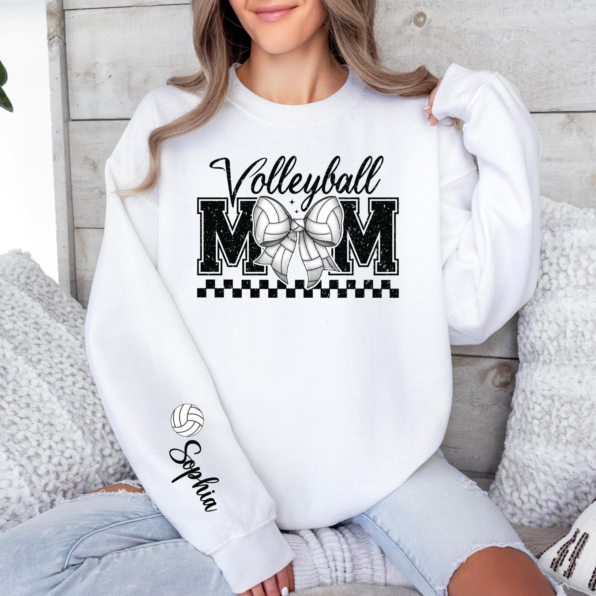 Beige volleyball mom crewneck featuring varsity MOM lettering and customizable sleeve.