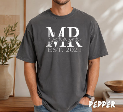 Custom last name t-shirt featuring elegant script family name over bold initials with personalized established date.