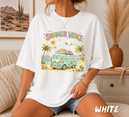 Retro watercolor Summer Vibes graphic featuring a pastel vintage camper van with surfboards, palm trees, flowers, peace signs, and a tropical beach scene printed on a white unisex t-shirt.