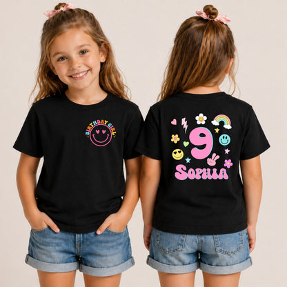 Personalized black birthday shirt featuring a colorful retro smiley on the front and custom name Sophia with number 9 on the back for girls birthday celebration.