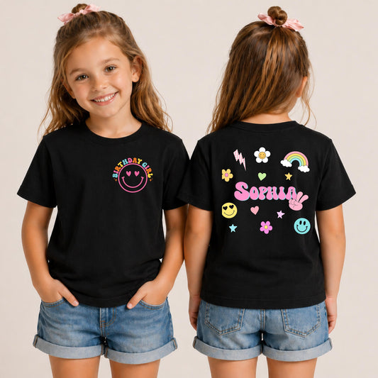 Personalized black kids shirt with colorful retro smiley design on the front and custom name printed on the back.