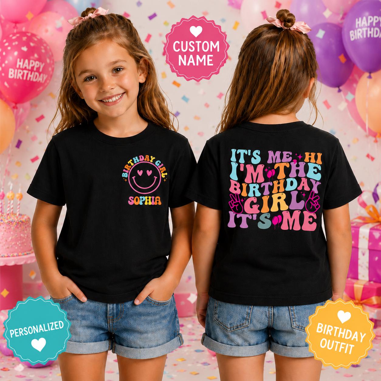 Young girl wearing a personalized black birthday shirt with a custom name smiley face design on the front and a colorful "It's Me Hi I'm The Birthday Girl" graphic on the back.