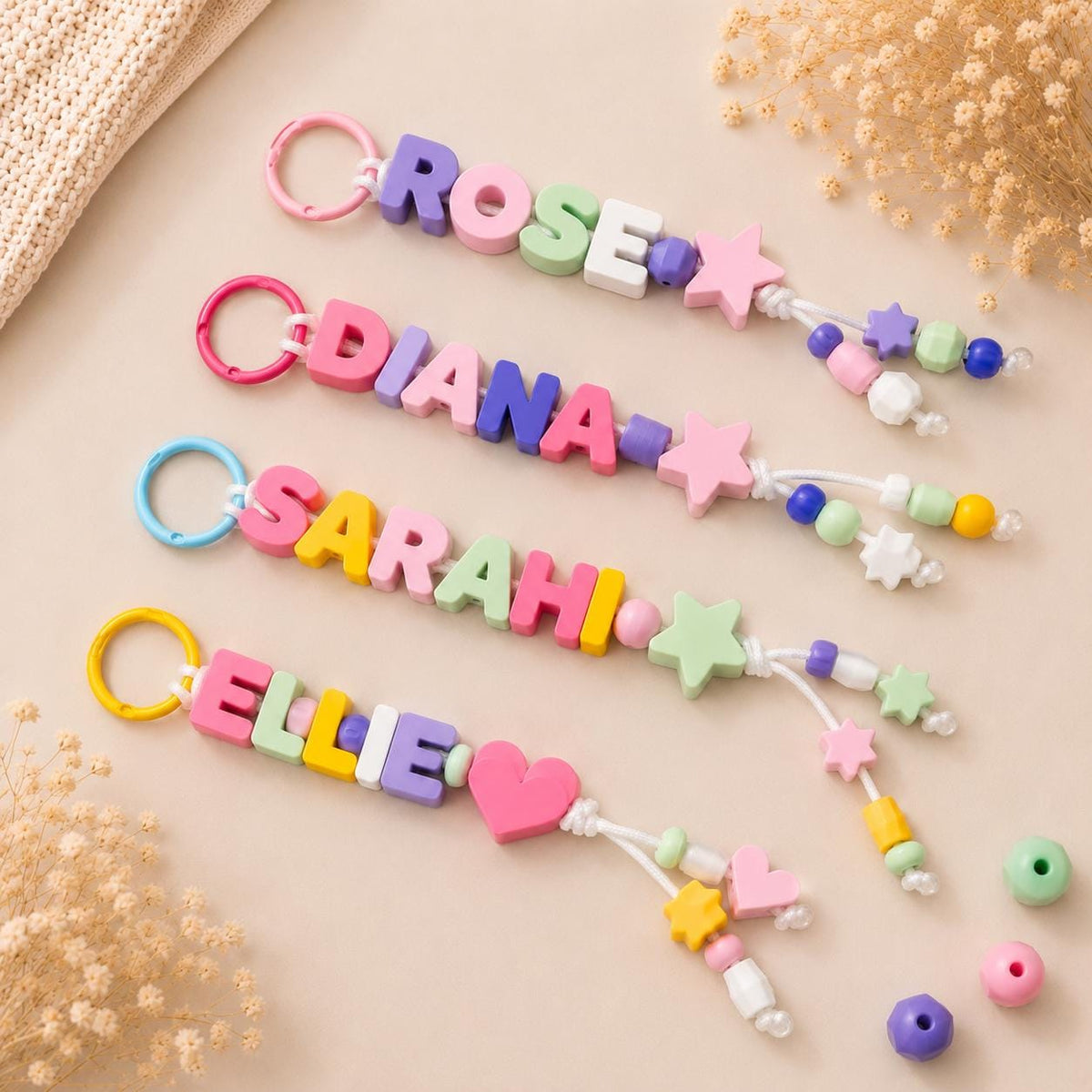 Collection of colorful personalized bag charms displayed on a neutral background, perfect for backpacks, purses, and keys.