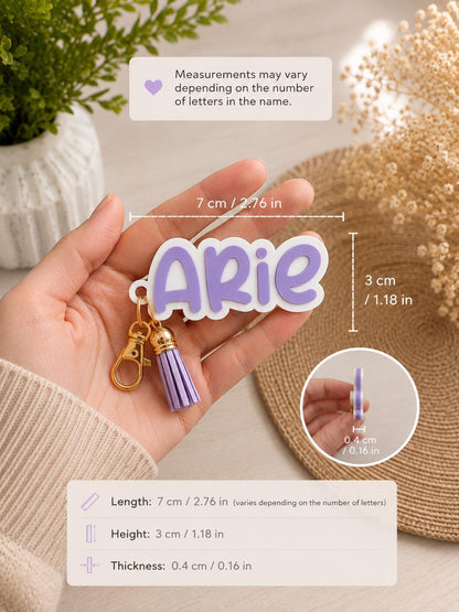 Custom name keychain held in hand showing approximately 7 cm long, 3 cm high and 0.4 cm thick for a four-letter name.