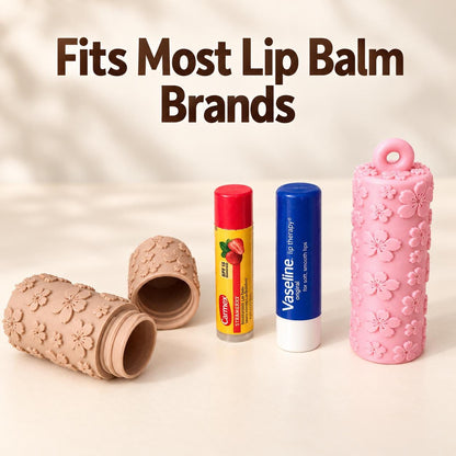 Floral lip balm keychain holder shown open to demonstrate how a standard lip balm tube fits inside.